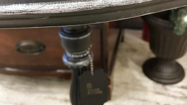 BLACK AND SILVER PEDESTAL TABLE
