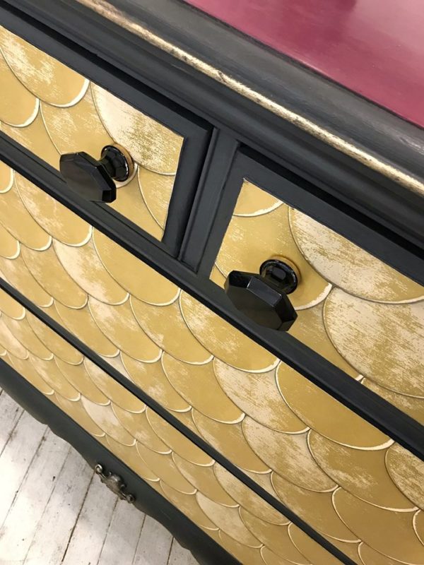 FOUR DRAWER DRESSER ON WHEELS WITH TEMPAPER
